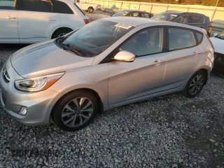2015 Hyundai Accent Sport with VIN KMHCU5AEXFU233647, listed as a Copart auction lot 80048004 with 90,875 mi miles and Salvage Title. Bid and sale history available at carsss.com. Image 1.