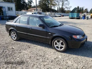 2003 Mazda Protege DX with VIN JM1BJ226231214537, listed as a Copart auction lot 54448615 with 147,753 mi miles and Salvage Title. Bid and sale history available at DreamBid. Image 4.