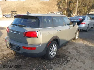 2019 MINI Clubman Cooper with VIN WMWLN5C59K2G82399, listed as a IAAI auction lot 41349514 with 64,235 mi miles. Bid and sale history available at carsss.com. Image 4.