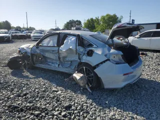 2023 Honda Civic Touring z VIN 2HGFE1F97PH305882, wystawiony jako Copart lot #54826915 z przebiegiem Nie podano mil oraz Szkody całkowita. Historia ofert i sprzedaży dostępna na DreamBid. Obrazek 2.