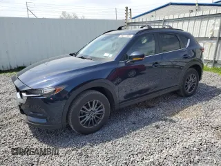 2021 Mazda CX-5 Touring with VIN JM3KFBCM0M0302015, listed as a Copart auction lot 55077305 with 40,558 mi miles and Salvage Title. Bid and sale history available at carsss.com. Image 1.