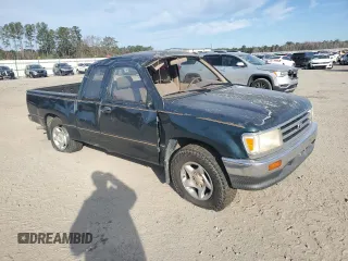1995 Toyota T100 DX with VIN JT4VD12E1S0012010, listed as a Copart auction lot 83223154 with 253,492 mi miles and Salvage Title. Bid and sale history available at DreamBid. Image 4.