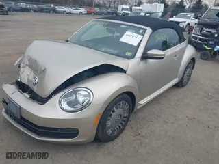 2013 Volkswagen Beetle Convertible 2.5L with VIN 3VW5X7AT6DM817668, listed as a IAAI auction lot 41676714 with 63,158 mi miles. Bid and sale history available at carsss.com. Image 17.