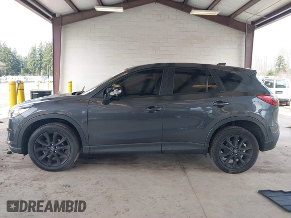 2015 Mazda CX-5 Grand Touring with VIN JM3KE2DY0F0508796, listed as a IAAI auction lot 41798482 with 110,260 mi miles. Bid and sale history available at carsss.com. Image 14.
