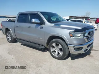 2021 Ram 1500 Laramie z VIN 1C6SRFJT0MN740352, wystawiony jako IAAI lot #41859488 z przebiegiem 71 519 mil mil oraz . Historia ofert i sprzedaży dostępna na DreamBid. Obrazek 1.
