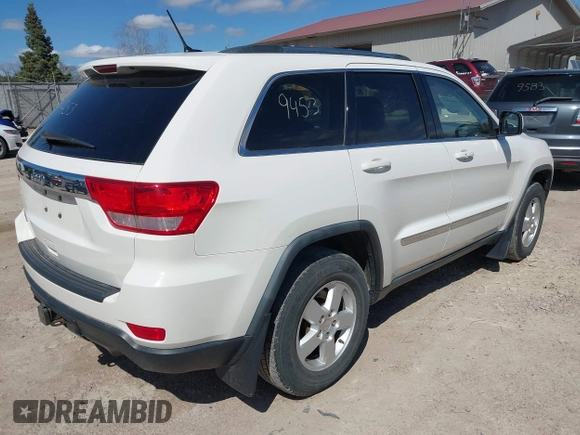 2011 Jeep Grand Cherokee Laredo with VIN 1J4RR4GG9BC556083, listed as a IAAI auction lot 42139453 with 145,623 mi miles and . Bid and sale history available at DreamBid. Image 4.