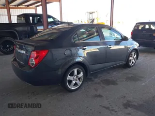 2016 Chevrolet Sonic LTZ z VIN 1G1JE5SB6G4160588, wystawiony jako IAAI lot #41843199 z przebiegiem 176 581 mil mil oraz . Historia ofert i sprzedaży dostępna na DreamBid. Obrazek 4.