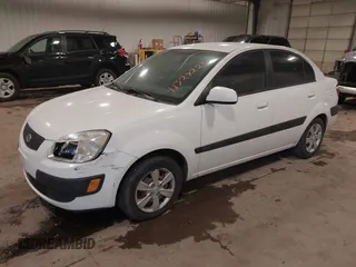 2009 Kia Rio SX with VIN KNADE223896533839, listed as a IAAI auction lot 41328220 with 140,968 mi miles. Bid and sale history available at carsss.com. Image 2.
