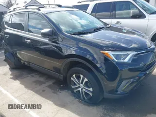 2018 Toyota RAV4 LE with VIN 2T3ZFREV9JW457062, listed as a IAAI auction lot 41696609 with 96,716 mi miles. Bid and sale history available at carsss.com. Image 1.