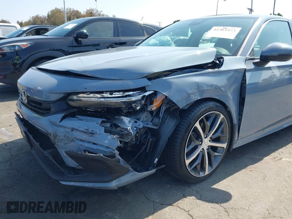 2023 Honda Civic Touring with VIN 2HGFE1F92PH322377, listed as a IAAI auction lot 42361473 with 43,533 mi miles and . Bid and sale history available at DreamBid. Image 6.