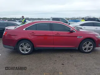 2015 Ford Taurus SEL with VIN 1FAHP2E8XFG137526, listed as a IAAI auction lot 41909658 with 147,992 mi miles and . Bid and sale history available at carsss.com. Image 13.