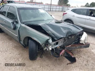 2005 Mercury Grand Marquis LS Premium z VIN 2MEHM75W45X662040, wystawiony jako IAAI lot #41697234 z przebiegiem 214 410 mil mil oraz . Historia ofert i sprzedaży dostępna na DreamBid. Obrazek 6.