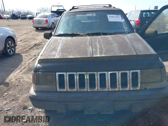 1993 Jeep Grand Cherokee Laredo with VIN 1J4GZ58S1PC680016, listed as a IAAI auction lot 41813392 with 149,520 mi miles. Bid and sale history available at carsss.com. Image 6.