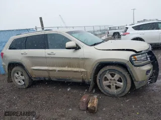 2011 Jeep Grand Cherokee Laredo with VIN 1J4RR4GG9BC563065, listed as a IAAI auction lot 41798136 with 192,149 mi miles. Bid and sale history available at carsss.com. Image 13.