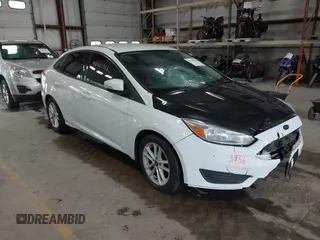 2017 Ford Focus SE z VIN 1FADP3F21HL303635, wystawiony jako IAAI lot #42423956 z przebiegiem 87 952 mil mil oraz . Historia ofert i sprzedaży dostępna na DreamBid. Obrazek 1.