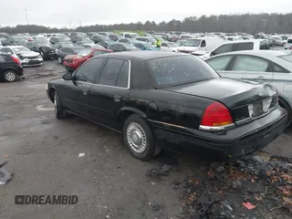 1999 Ford Crown Victoria Police with VIN 2FAFP71W3XX130521, listed as a IAAI auction lot 41384939 with 257,504 mi miles. Bid and sale history available at carsss.com. Image 3.