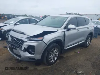 2019 Hyundai Santa Fe SE z VIN 5NMS23AD4KH130517, wystawiony jako IAAI lot #42324854 z przebiegiem 76 963 mil mil oraz . Historia ofert i sprzedaży dostępna na DreamBid. Obrazek 2.