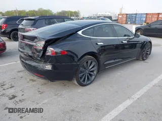 2017 Tesla Model S 100D with VIN 5YJSA1E28HF188981, listed as a IAAI auction lot 42010115 with 76,327 mi miles and . Bid and sale history available at DreamBid. Image 4.