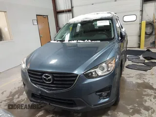 2016 Mazda CX-5 Grand Touring z VIN JM3KE4DY9G0714468, wystawiony jako IAAI lot #41860956 z przebiegiem 114 481 mil mil oraz . Historia ofert i sprzedaży dostępna na DreamBid. Obrazek 12.