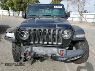 2020 Jeep Gladiator Rubicon z VIN 1C6JJTBG7LL197837, wystawiony jako Copart lot #58169095 z przebiegiem 59 578 mil mil oraz Szkoda całkowita • Salvage title. Historia ofert i sprzedaży dostępna na DreamBid. Obrazek 5.