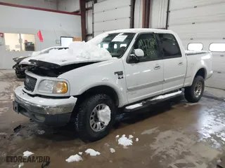 2001 Ford F-150 SuperCrew XLT with VIN 1FTRW08L41KF19093, listed as a IAAI auction lot 41419212 with 157,696 mi miles. Bid and sale history available at carsss.com. Image 17.
