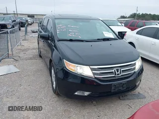 2013 Honda Odyssey Touring with VIN 5FNRL5H9XDB073706, listed as a IAAI auction lot 41591111 with 158,305 mi miles and . Bid and sale history available at carsss.com. Image 1.
