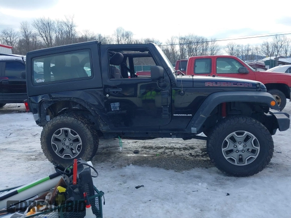2013 Jeep Wrangler Rubicon 10th Anniversary with VIN 1C4BJWCG3DL591186, listed as a IAAI auction lot 41315969 with 54,984 mi miles and . Bid and sale history available at DreamBid. Image 14.