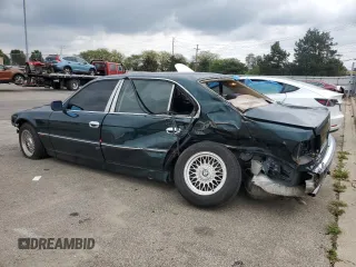 1998 BMW 7 Series 740il with VIN WBAGJ8329WDM24296, listed as a Copart auction lot 73581634 with 247,498 mi miles and Salvage Title. Bid and sale history available at carsss.com. Image 2.