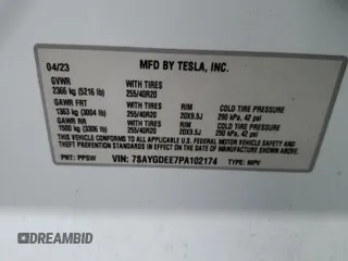 2023 Tesla Model Y Long Range z VIN 7SAYGDEE7PA102174, wystawiony jako Copart lot #49904435 z przebiegiem 144 702 mil mil oraz Szkoda całkowita • Salvage title. Historia ofert i sprzedaży dostępna na DreamBid. Obrazek 14.