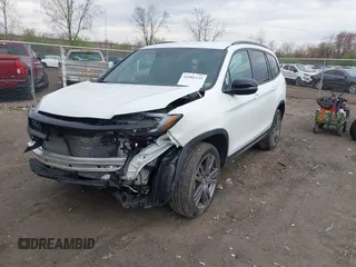2022 Honda Pilot Sport with VIN 5FNYF6H32NB051544, listed as a IAAI auction lot 42081135 with 16,728 mi miles and . Bid and sale history available at carsss.com. Image 2.