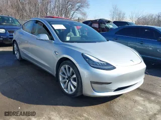 2018 Tesla Model 3 Long Range Battery with VIN 5YJ3E1EB3JF117007, listed as a IAAI auction lot 41753572 with 82,444 mi miles. Bid and sale history available at carsss.com. Image 1.