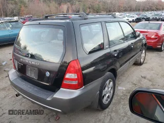 2003 Subaru Forester XS with VIN JF1SG65623H724854, listed as a Copart auction lot 82579774 with 176,986 mi miles and Salvage Title. Bid and sale history available at carsss.com. Image 3.