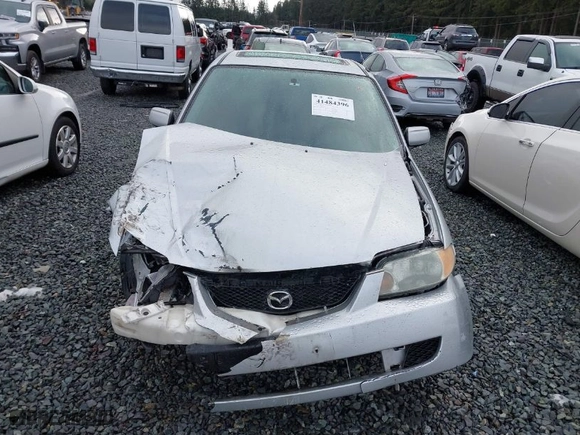 2003 Mazda Protege DX with VIN JM1BJ225330147296, listed as a IAAI auction lot 41484396 with 222,448 mi miles. Bid and sale history available at carsss.com. Image 12.