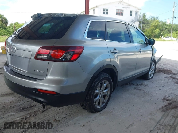 2015 Mazda CX-9 Sport with VIN JM3TB2BA0F0447436, listed as a IAAI auction lot 42480482 with 127,557 mi miles and . Bid and sale history available at DreamBid. Image 4.
