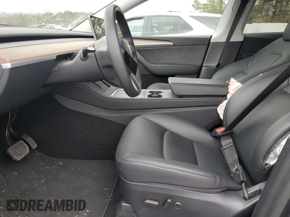 2025 Tesla Model Y Long Range with VIN 7SAYGDED9SA341967, listed as a Copart auction lot 47368695 with 4,310 mi miles and Salvage Title. Bid and sale history available at DreamBid. Image 7.