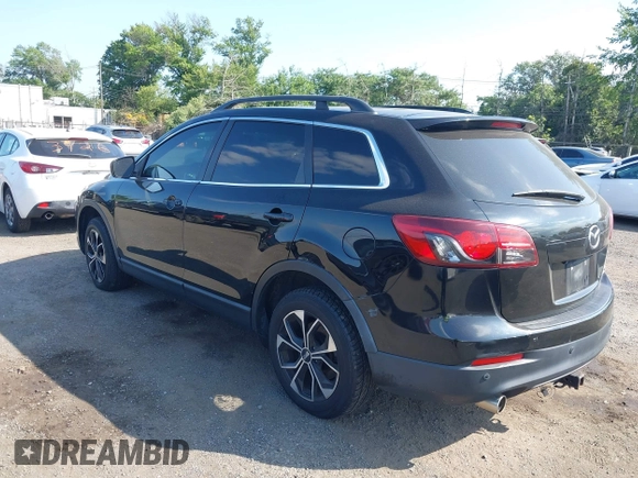 2013 Mazda CX-9 Touring with VIN JM3TB3CV2D0411543, listed as a IAAI auction lot 42777611 with 193,224 mi miles and . Bid and sale history available at DreamBid. Image 3.