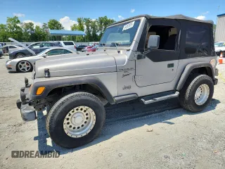 2001 Jeep Wrangler Sport z VIN 1J4FA49S21P374356, wystawiony jako Copart lot #63568695 z przebiegiem 202 853 mil mil oraz Czysty tytuł • Clean title. Historia ofert i sprzedaży dostępna na DreamBid. Obrazek 1.