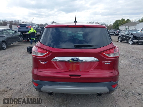 2016 Ford Escape Titanium with VIN 1FMCU9JX2GUA89716, listed as a IAAI auction lot 41899786 with 85,474 mi miles and . Bid and sale history available at DreamBid. Image 16.