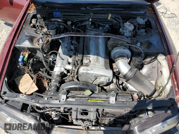 1990 Nissan Skyline z VIN BNR32011442, wystawiony jako Copart lot #64651064 z przebiegiem 118 579 mil mil oraz Czysty tytuł • Clean title. Historia ofert i sprzedaży dostępna na DreamBid. Obrazek 11.