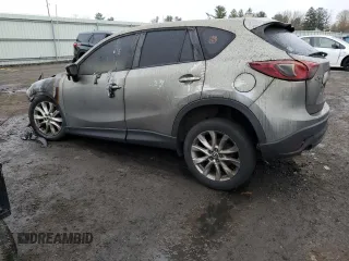 2015 Mazda CX-5 Grand Touring with VIN JM3KE4DY6F0528286, listed as a Copart auction lot 52367765 with Not Provided miles and Salvage Title. Bid and sale history available at DreamBid. Image 2.