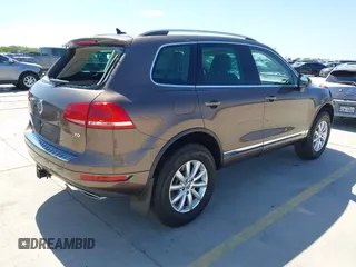 2012 Volkswagen Touareg Sport z VIN WVGFK9BPXCD000566, wystawiony jako IAAI lot #41971781 z przebiegiem 234 574 mil mil oraz . Historia ofert i sprzedaży dostępna na DreamBid. Obrazek 4.