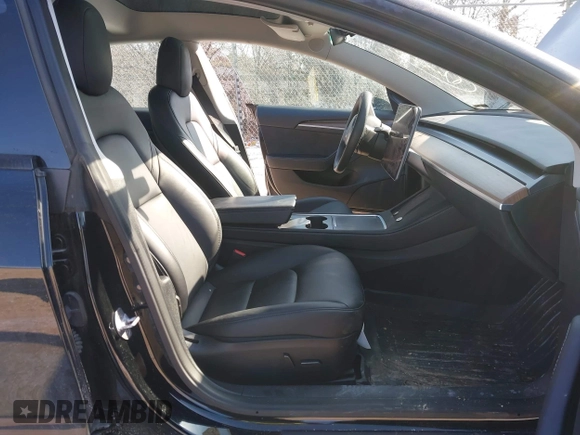 2022 Tesla Model 3 with VIN 5YJ3E1EA1NF304811, listed as a IAAI auction lot 41559342 with 29,597 mi miles and . Bid and sale history available at DreamBid. Image 5.
