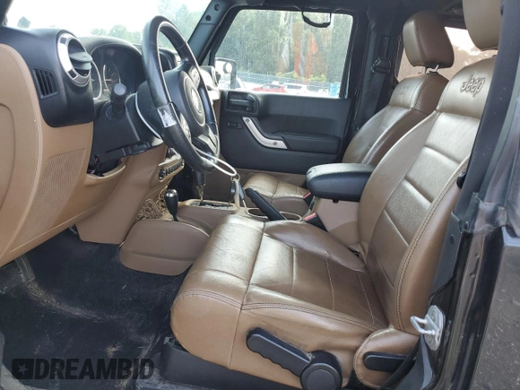 2011 Jeep Wrangler Sahara with VIN 1J4AA5D15BL552185, listed as a Copart auction lot 63065185 with 159,850 mi miles and Salvage title. Bid and sale history available at DreamBid. Image 7.