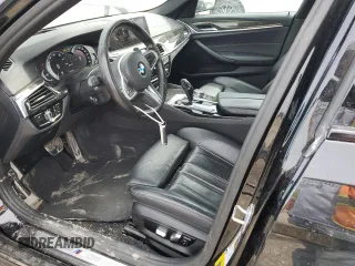 2018 BMW 5 Series 530e xDrive with VIN WBAJB1C51JG623953, listed as a Copart auction lot 51149905 with 86,799 mi miles and Salvage title. Bid and sale history available at DreamBid. Image 7.