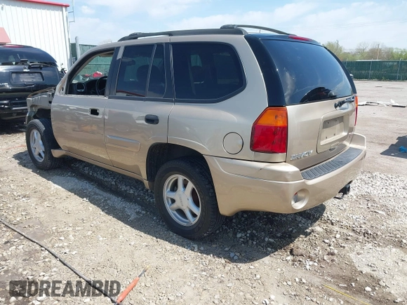 2005 GMC Envoy SLE with VIN 1GKDT13S252264932, listed as a IAAI auction lot 41981566 with 140,566 mi miles. Bid and sale history available at carsss.com. Image 3.