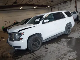 2018 Chevrolet Tahoe Commercial with VIN 1GNSKDEC7JR240082, listed as a IAAI auction lot 41608557 with 111,834 mi miles. Bid and sale history available at carsss.com. Image 2.