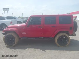 2012 Jeep Wrangler Unlimited Sahara with VIN 1C4HJWEGXCL209449, listed as a IAAI auction lot 41864432 with 100,917 mi miles. Bid and sale history available at carsss.com. Image 14.