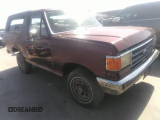 1990 Ford Bronco XL with VIN 1FMEU15N7LLA25223, listed as a IAAI auction lot 41858217 with 196,000 mi miles. Bid and sale history available at carsss.com. Image 1.
