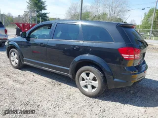 2013 Dodge Journey SE with VIN 3C4PDCAB3DT529696, listed as a IAAI auction lot 41885319 with 130,947 mi miles. Bid and sale history available at carsss.com. Image 3.