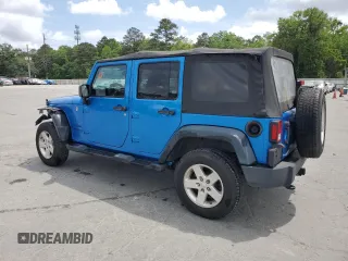 2015 Jeep Wrangler Unlimited Willys Wheeler with VIN 1C4BJWDG4FL611656, listed as a Copart auction lot 54010395 with 129,797 mi miles and Salvage Title. Bid and sale history available at DreamBid. Image 2.